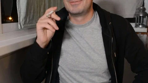 Man Smokes Cigarette Stock Footage 82132821