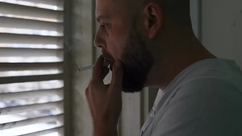 A man smokes a cigarette Stock Footage 122109960