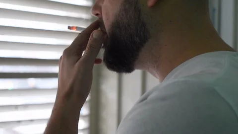 A man smokes a cigarette Stock-Footage 122109978