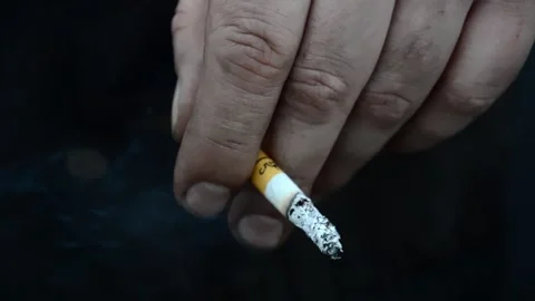Man smokes a cigarette Stock Footage 303352836