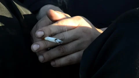 Man smokes a cigarette Stock Footage 314584633