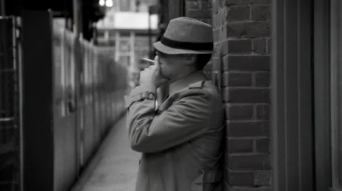 Man Smokes Cigarette At A Train Station Stock Footage 27236077