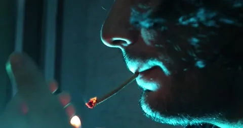 Man Smokes a Cigarette While something Else is on his Mind Stock Footage 217398084