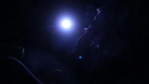 Man smokes in the dark Stock Footage 75193333