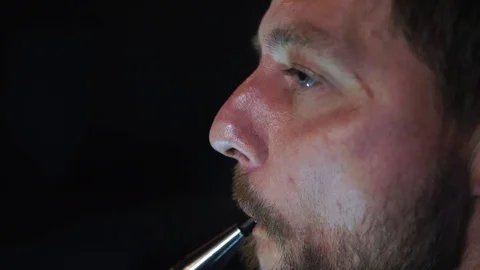Man smokes hookah in a bar. 動画素材 90430428