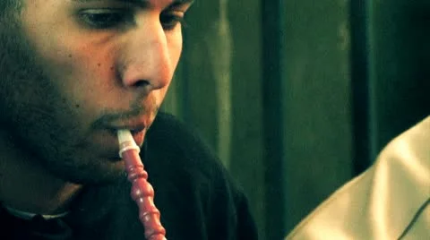 Man Smokes Hookah Water Pipe Stock Footage 10787508