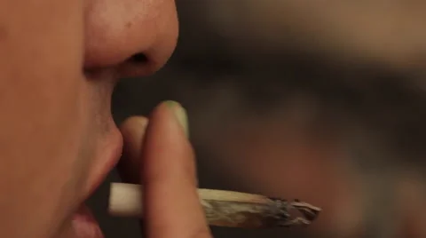 Man Smokes A Joint , Closeup,  Re- Lights Marihuana. Stock Footage 48517302