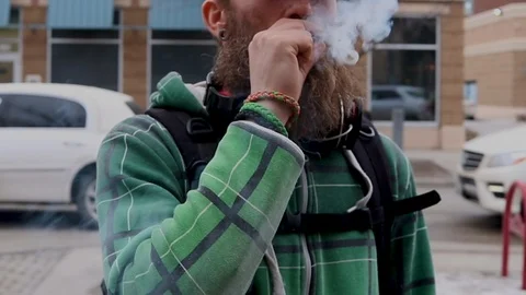 Man Smokes Marijuana Joint Stock Footage 117127428
