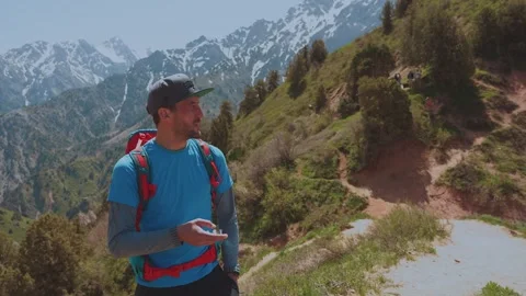 A man smokes in the mountains Stock Footage 299583482