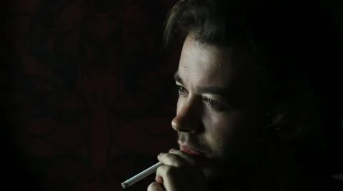 Man smokes in shadow V4 - HD Stock Footage 12239366