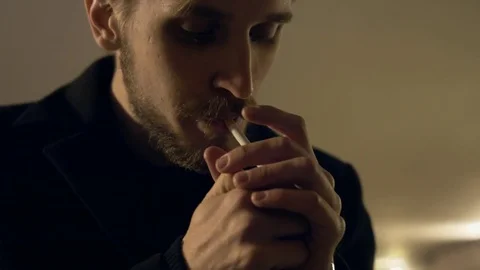 A man smokes in an underground passage Видео 81595651