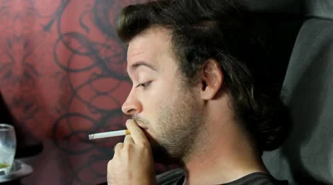 Man smokes V3 - HD Stock Footage 12241220