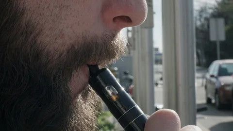 Man smokin electronic cigarette Stock Footage 106756341