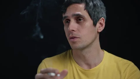 Man Smoking and Talking, Engaged in Philosophical Discussion Stock Footage 295336101