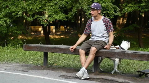Man Smoking on a Bench 1 Stock Footage 52196372