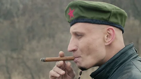 Man smoking a cigar close up Stock Footage 106046060
