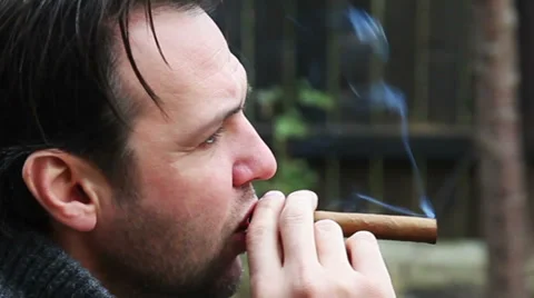 Man smoking cigar Stock Footage 34254090