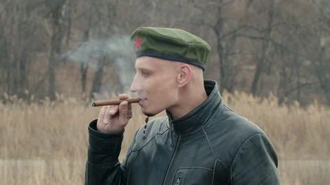 Man smoking a cigar Stock Footage 106045445