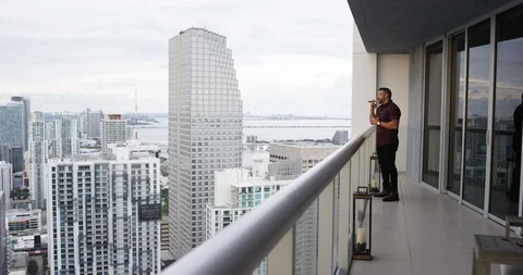Man smoking cigar while having whisky Stock Footage 116347945