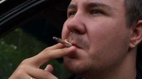 Man smoking a cigarette close up Stock Footage 161068318