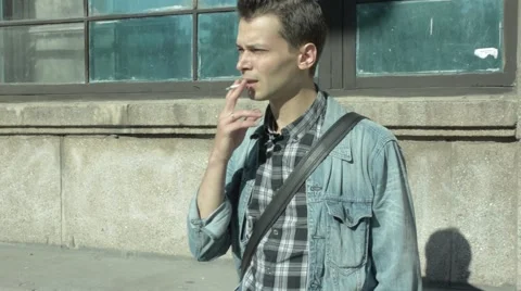 A man smoking a cigarette Stock Footage 51757371
