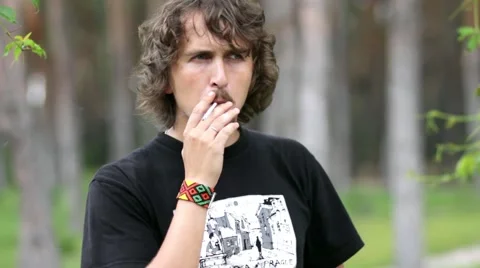 A man smoking a cigarette Stock Footage 61723468