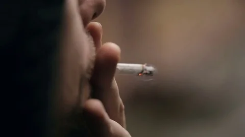 Man smoking a cigarette Video stock 82444497