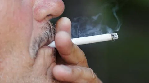 Man smoking a cigarette Stock Photos