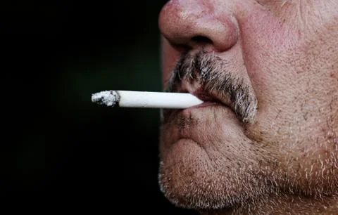 Man smoking a cigarette Stock Photos