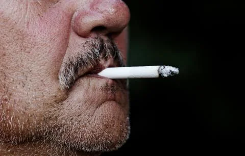 Man smoking a cigarette Stock Photos