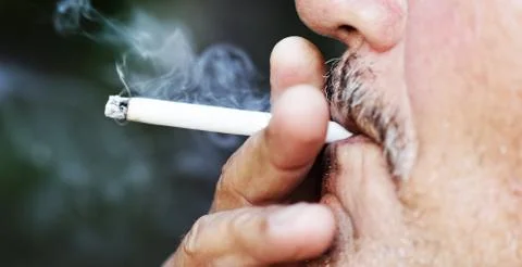 Man smoking a cigarette Stock Photos