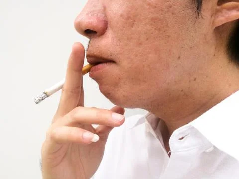Man smoking a cigarette Stock Photos
