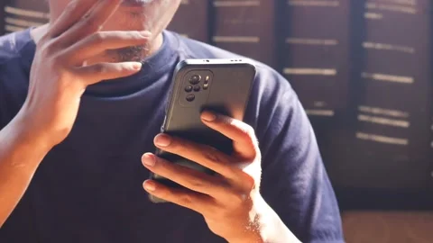 Man smoking cigarette while using smartphone Stock-Footage 334049298