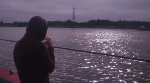 Man smoking on the dock 스톡 동영상 41632580