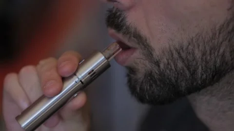 Man smoking an e-cigarette Video stock 55499054