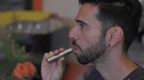 Man smoking an e-cigarette Video stock 55499541