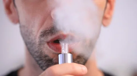 Man smoking an e-cigarette 動画素材 57678562