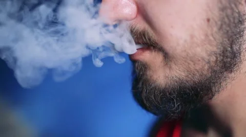 Man smoking electronic cigarette Stock Footage 65259503