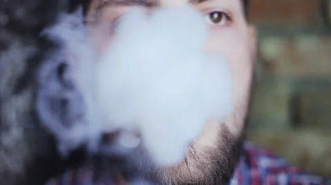 Man smoking electronic cigarette Stock Footage 65609416