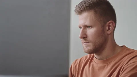 Man Smoking Electronic Cigarette while Working on Computer Stock Footage 218712282