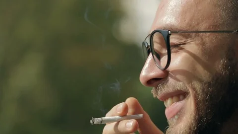 Man smoking a joint Video stock 95039134