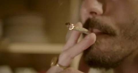 Man smoking a joint. Stock Footage 149078686
