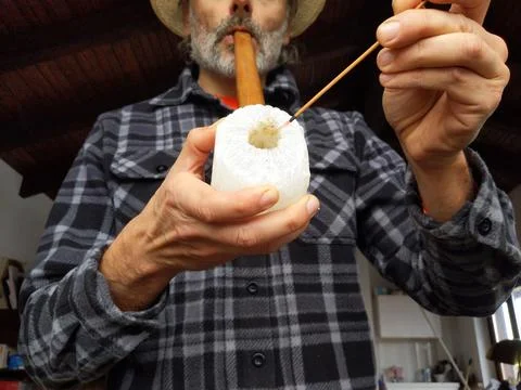 Man smoking an old pipe Stock Photos