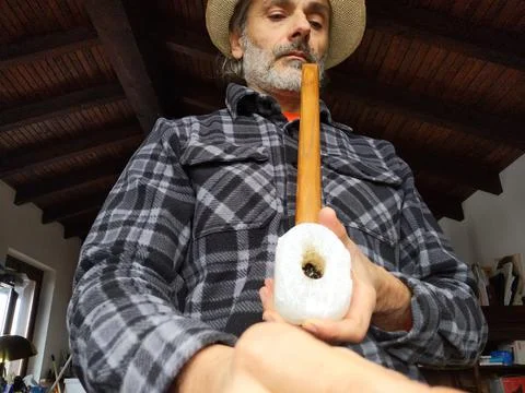 Man smoking an old pipe Stock Photos