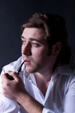 Man smoking a pipe Stock Photos