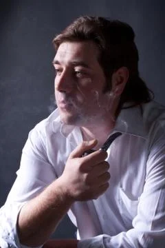 Man smoking a pipe Stock Photos