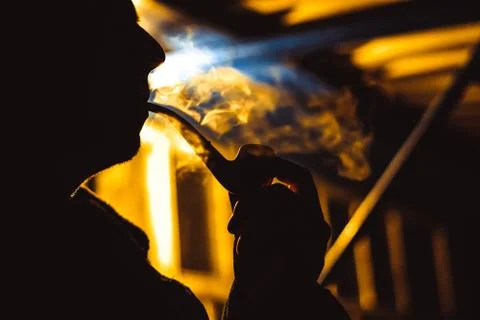 A man Smoking a pipe Stock Photos