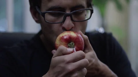 Man Smoking Weed from an Apple Pipe 3 Stock Footage 73096516