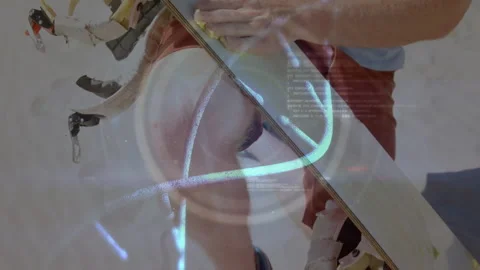 Man smoothing snowboard wax on tech bench, integrating glowing circular Stock Footage 309096678