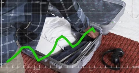 Man smoothing, stacking layers and tucking headphones while graph animates over Stock Footage 319679242